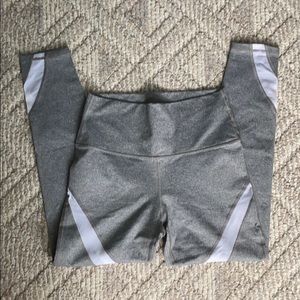 Gray leggings with white mesh inserts